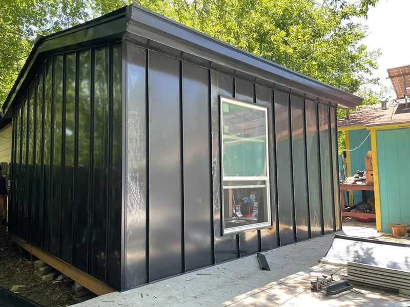 Black standing seam metal wall panels for Metal Roof Installation in Four Square Mile