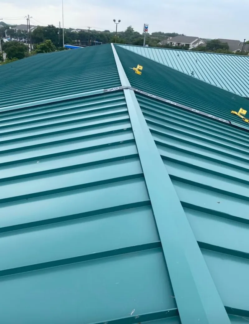 Green commercial metal roof ridge and valley for Metal Roof Repair in Four Square Mile